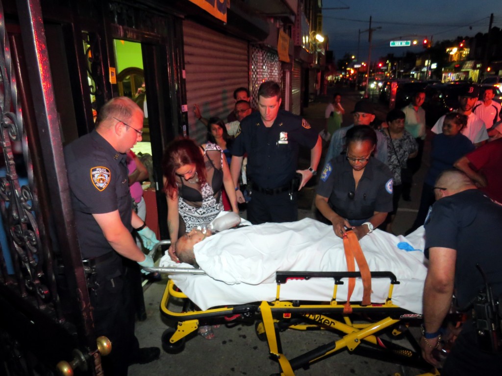 Police transport a 46-year-old man from an apartment on Liberty Avenue in Ozone Park where they say he was stabbed in the chest on Saturday night. Robert Stridiron/The Forum Newsgroup