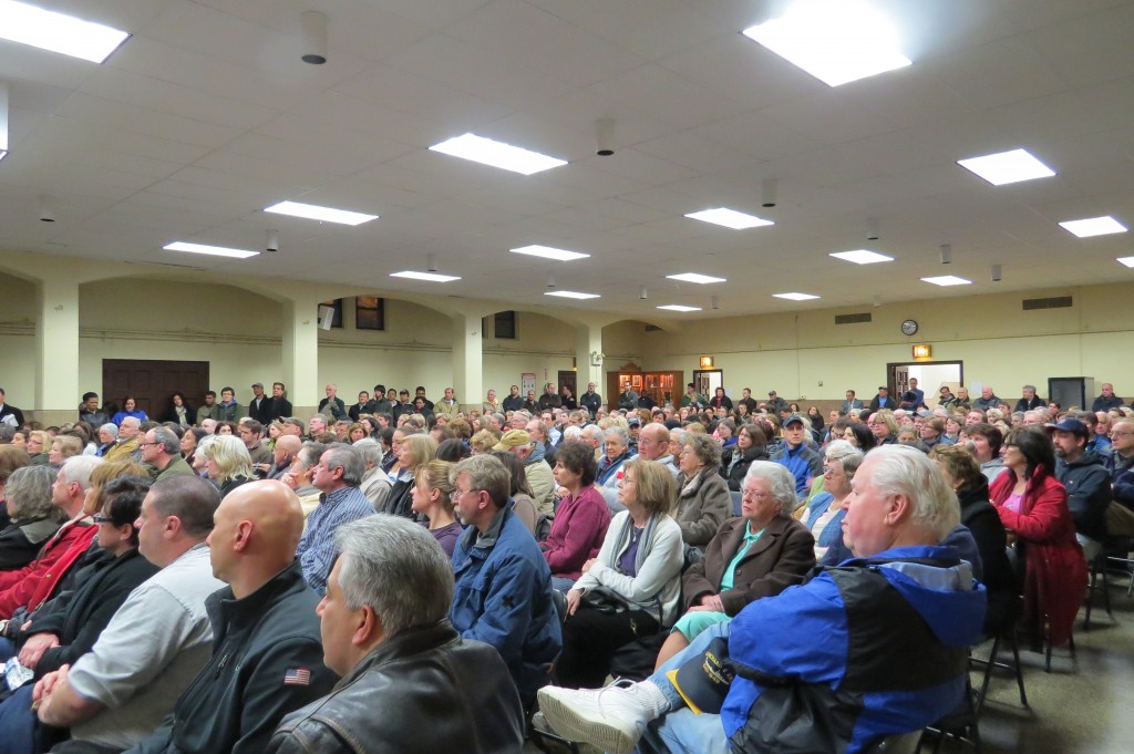 More than 400 community residents packed a hall in early April after the first burglary pattern emerged in Forest Hills. After swift arrests, police are now hunting for suspects in three more burglaries since June 21. File Photo