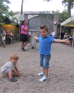 Astoria youngsters Gabriel Antal, left, and Marko Erdeljan play together in the beer garden’s courtyard. Families say the beer garden is one of the few family-friendly bars in Queens because of its large outdoor space and numerous activities for the younger residents.