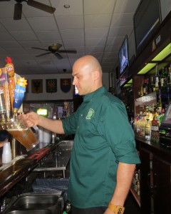 Bartender Marcel Schuller fills up one of many pitchers of beer last week. The bar has an extensive beer list, including five Czech beers that are always on tap.