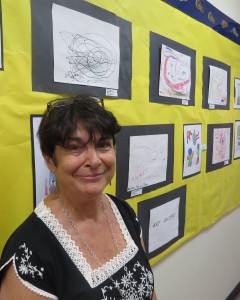 Dianne Cattrano, director of education at HeartShare, attends her organization's art show that showed off works by 3- to 5-year-olds, most of whom have disabilities that range from speech delays to autism and ADHD.
