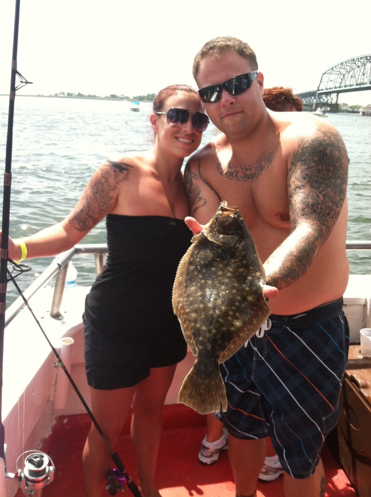 Regular CJ patrons Danielle and Mike Czech with their catch from CJ’s Second Annual Fishing Trip.