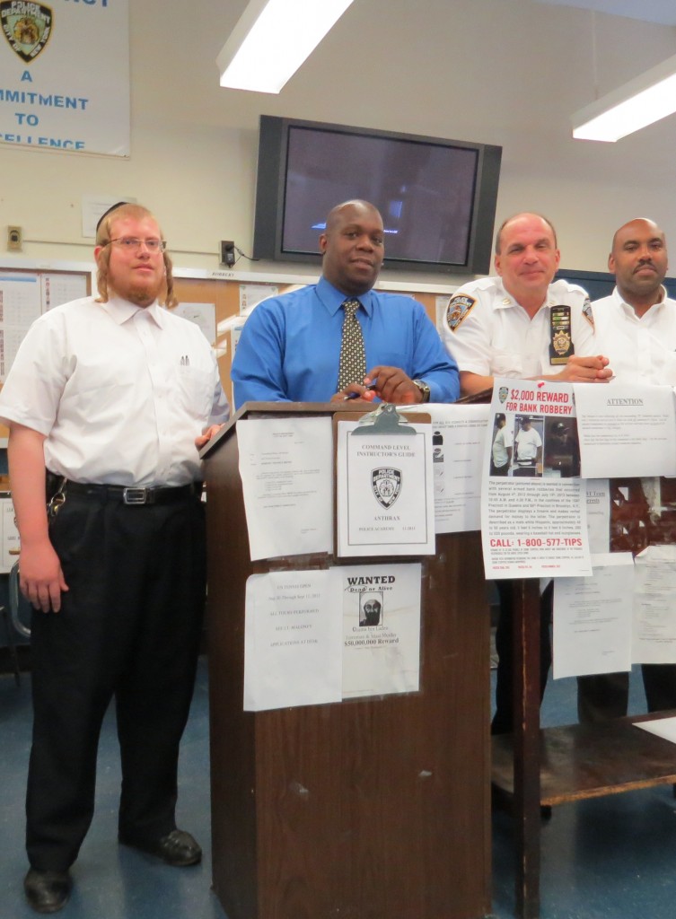 104th Community Council Vice-President Abraham Markowitz, left; Det. Thomas Bell, community affairs officer; Capt. Christopher Manson, commanding officer; and Community Affairs Officer Otoniel Jimenez meet with the media last week to talk about a variety of issues in the precinct. Crime Prevention Officer Brenda Hyatt, who is not pictured, also attended the meeting. Anna Gustafson/The Forum Newsgroup