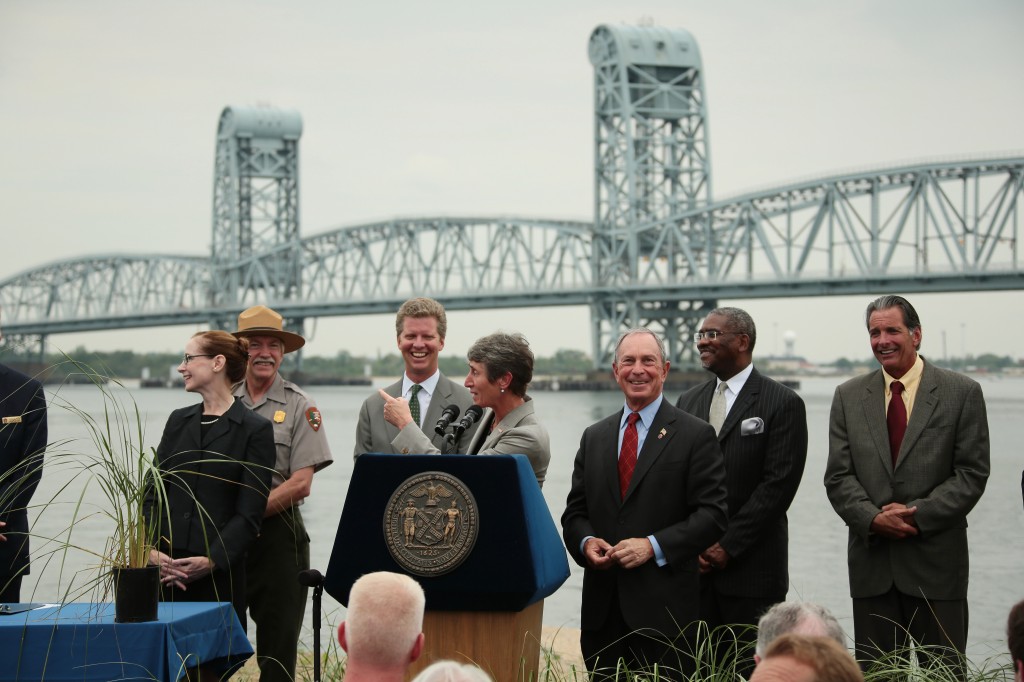 Mayor Bloomberg, third from right, and U.S. Interior Secretary Sally Jewell center at podium, and other officials announce the creation of the Jamaica Bay Science and Resilience Institute at a press conference in Rockaway this week. Photo Courtesy Edward Reed/Mayor Bloomberg's Office