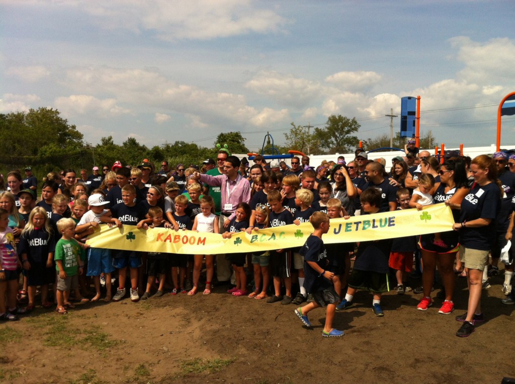 Hundreds of people, including residents, JetBlue volunteers, KaBOOM organizers and Councilman Eric Ulrich, gathered at the Broad Channel Athletic Club on Saturday to build a playground that was designed in part by neighborhood children. Photo Courtesy KaBOOM