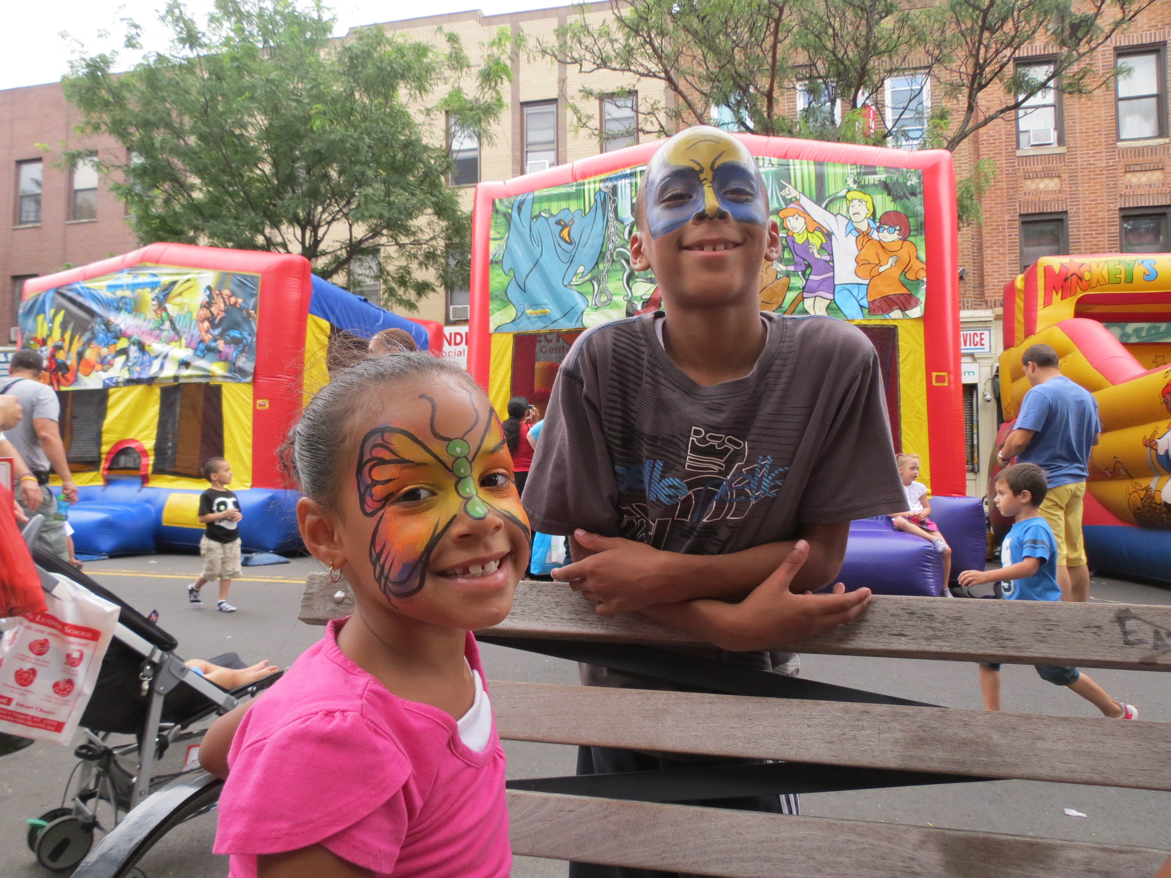 Siblings Jayla, 6, and Jason, 8, Centeno, show off their newly painted faces.