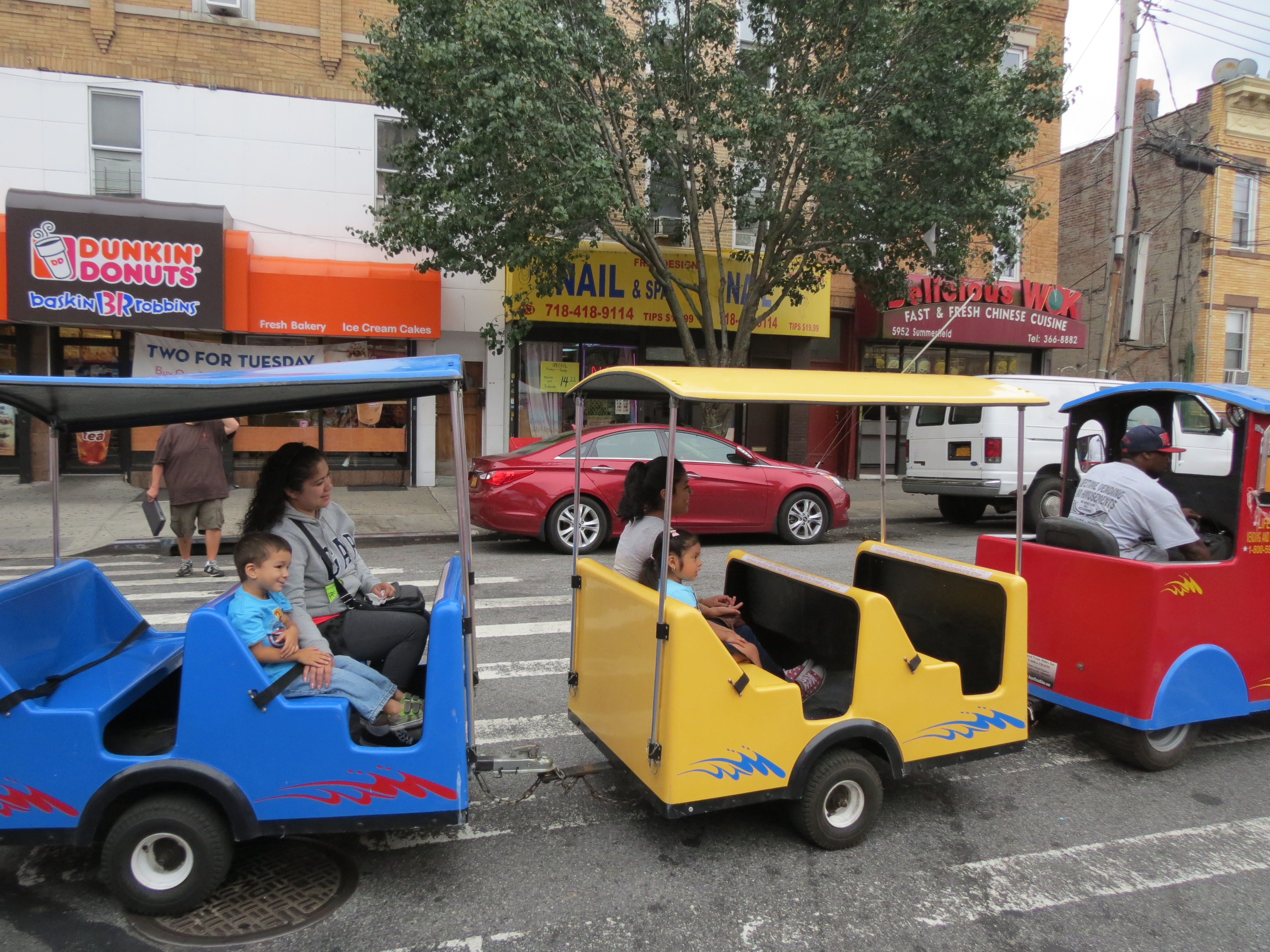 A colorful train took children on a ride around Myrtle Avenue.