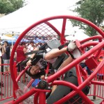 Festival goers braved a ride that spun them around and upside down.