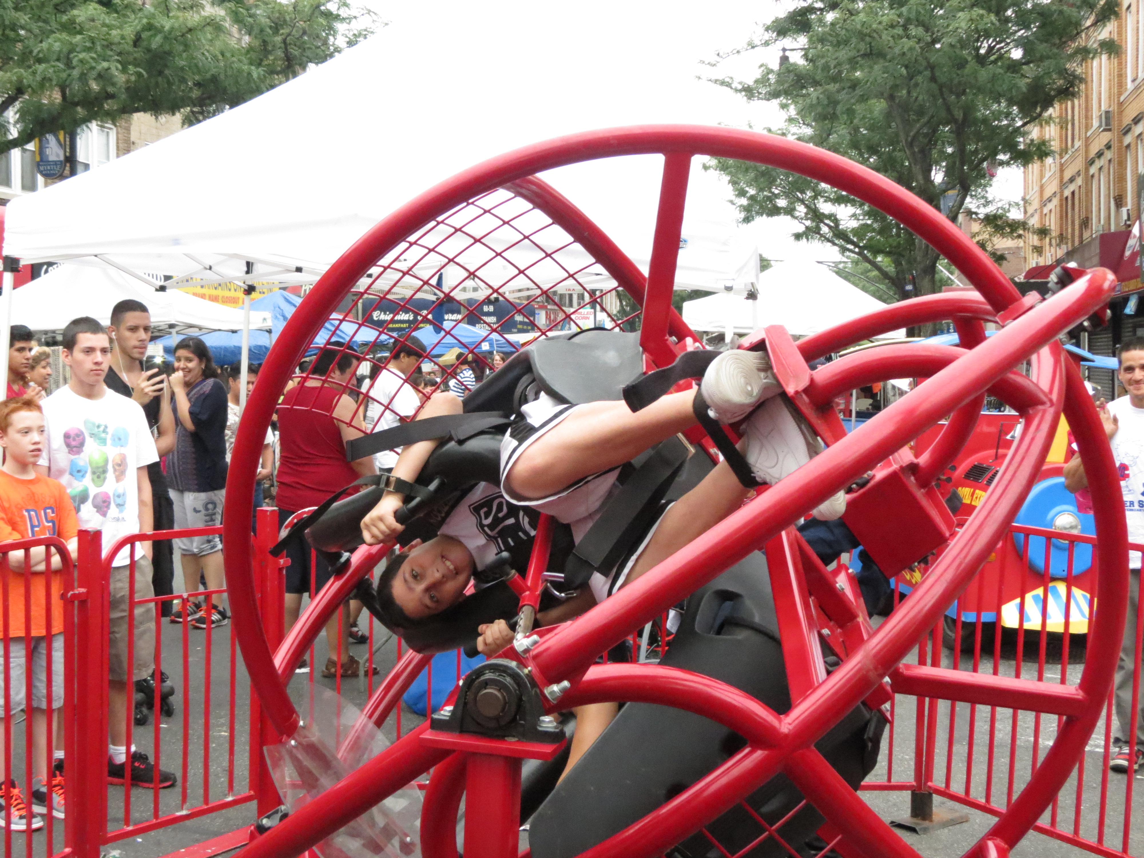 Festival goers braved a ride that spun them around and upside down.