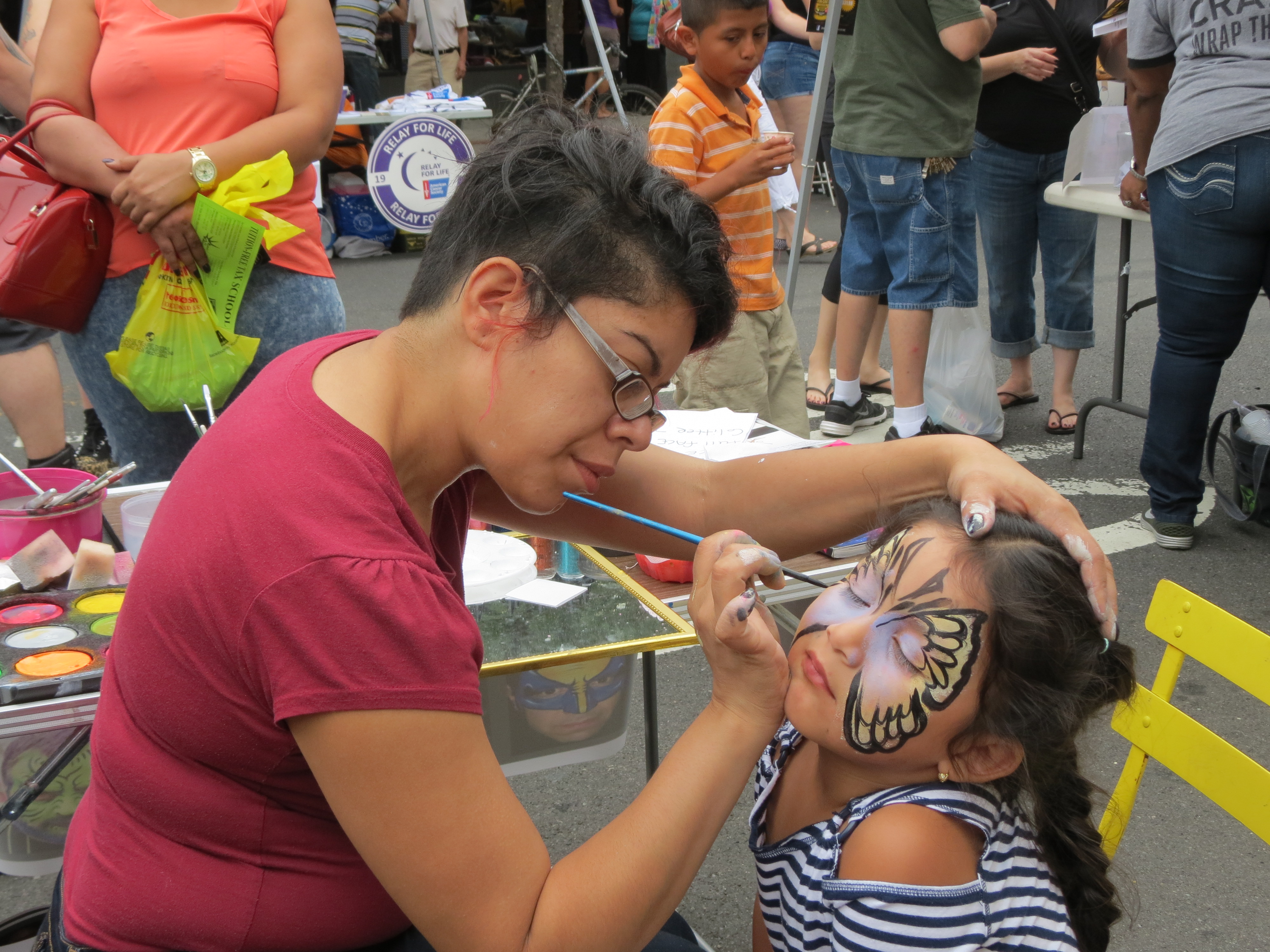 Ciara Hernandez, 3, has a butterfly painted on her face.