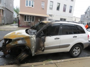The manhole fires left two cars badly scorched, including this one.