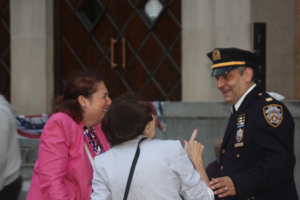 Heidi Chain, (right), president of the 112th Precinct Community Council and Commanding Officer Thomas Conforti share a laugh with a Forest Hills resident.