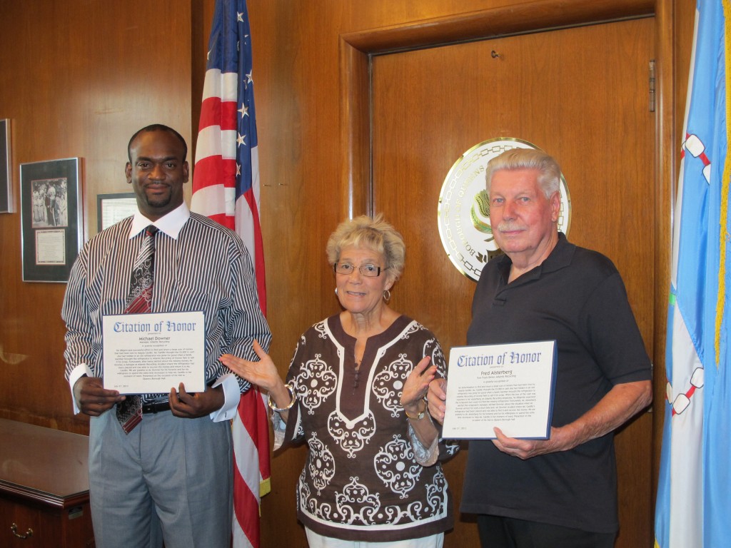 Borough President Helen Marshall commended Fred Alsterberg, left, and Michael Downer for returning about $5,000 to a woman who accidentally left it in a refrigerator that had been sold to a scrapyard in Ozone Park. Photo Courtesy of Queens Borough President Helen Marshall’s Office Queens