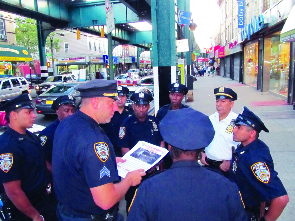 Police and Auxiliaries from the 102nd Precinct hung and distributed fliers along Jamaica Avenue and along side streets near to where the stabbing took place, announcing a $12,000 reward in the stabbing of Woodhaven resident Natasha Martinez. Photo Courtesy Josephine Wendell 