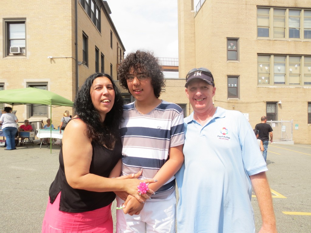 Youla Efthimiou, left, Thanos Kombaogiannis and Play4Autism Founder Greg Vasicek attend a day of festivities in Middle Village last weekend to raise awareness about autism.
