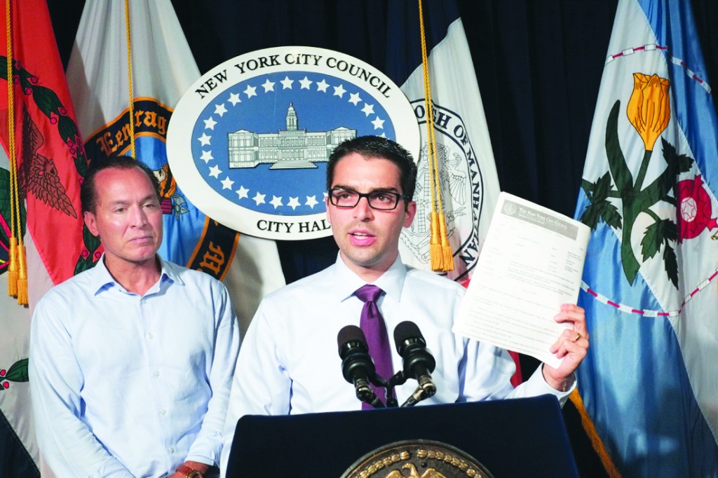 The City Council passed two resolutions - one sponsored by Councilman Eric Ulrich, center, and the other by Councilman Peter Vallone Jr. - that they hope will help homeowners impacted by Hurricane Sandy, as well as individuals in future disasters. Photo Courtesy William Alatriste/NYC Council 