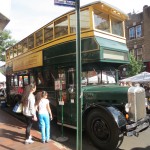 A double decker Fifth Avenue Coach Company bus, one of a number of vintage vehicles displayed at the festival, was parked outside the Ridgewood Theater. The bus operated from 1931 to 1953 and ran along the Fifth Avenue routes in Manhattan.