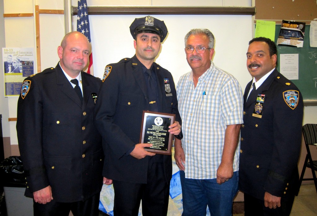 (Left to Right) Executive Officer John Ganley, "Cop of the Month" Officer Victor Sadarangani, Community Council President Frank Dardani, and Deputy Inspector Jeffrey Schiff at the 106th Precinct Community Council last week. Hannah Sheehan/The Forum Newsgroup