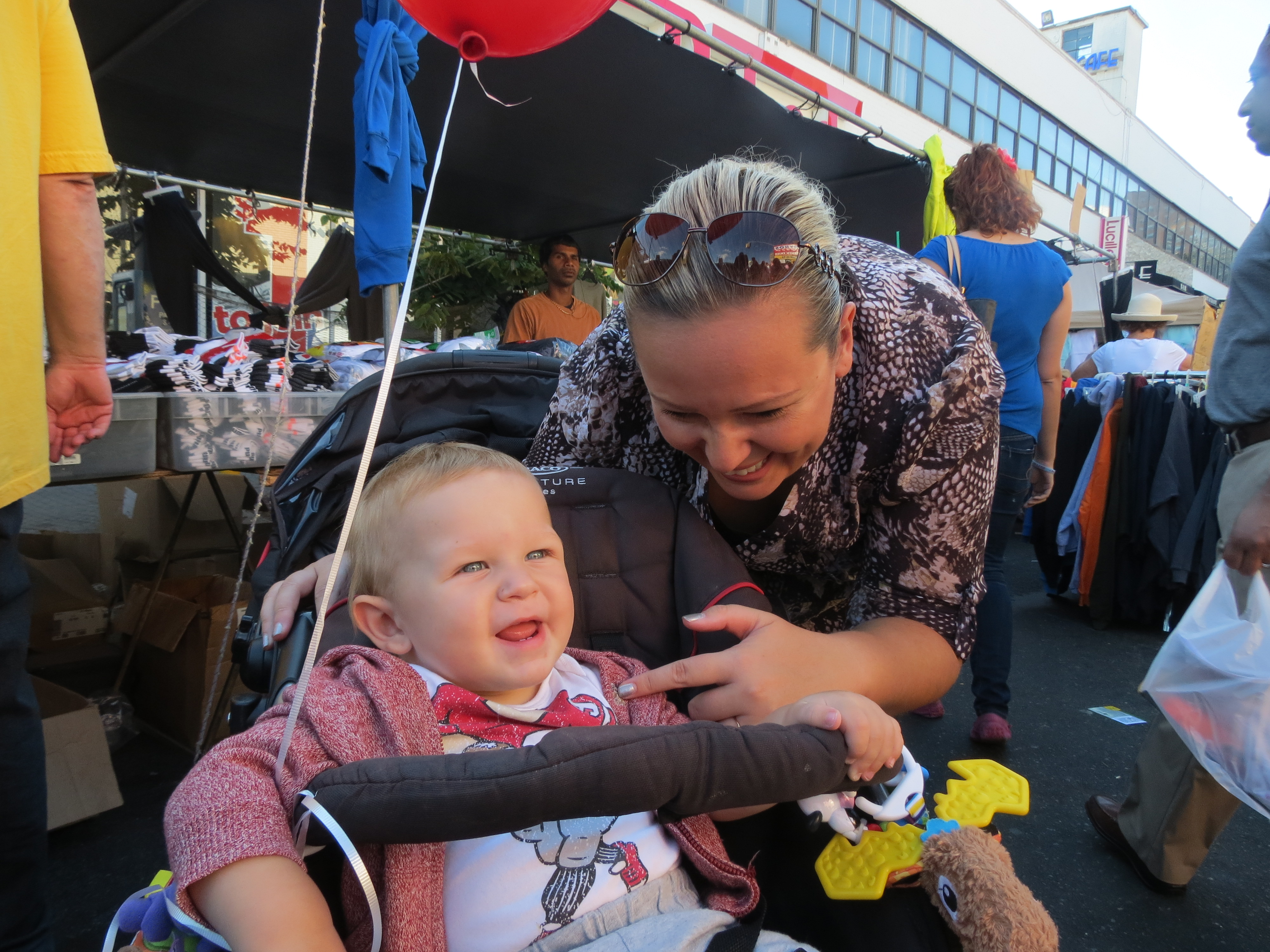 Dominic Groch, 10 months, and his mother, Paulina Balaban, have fun at the festivities.
