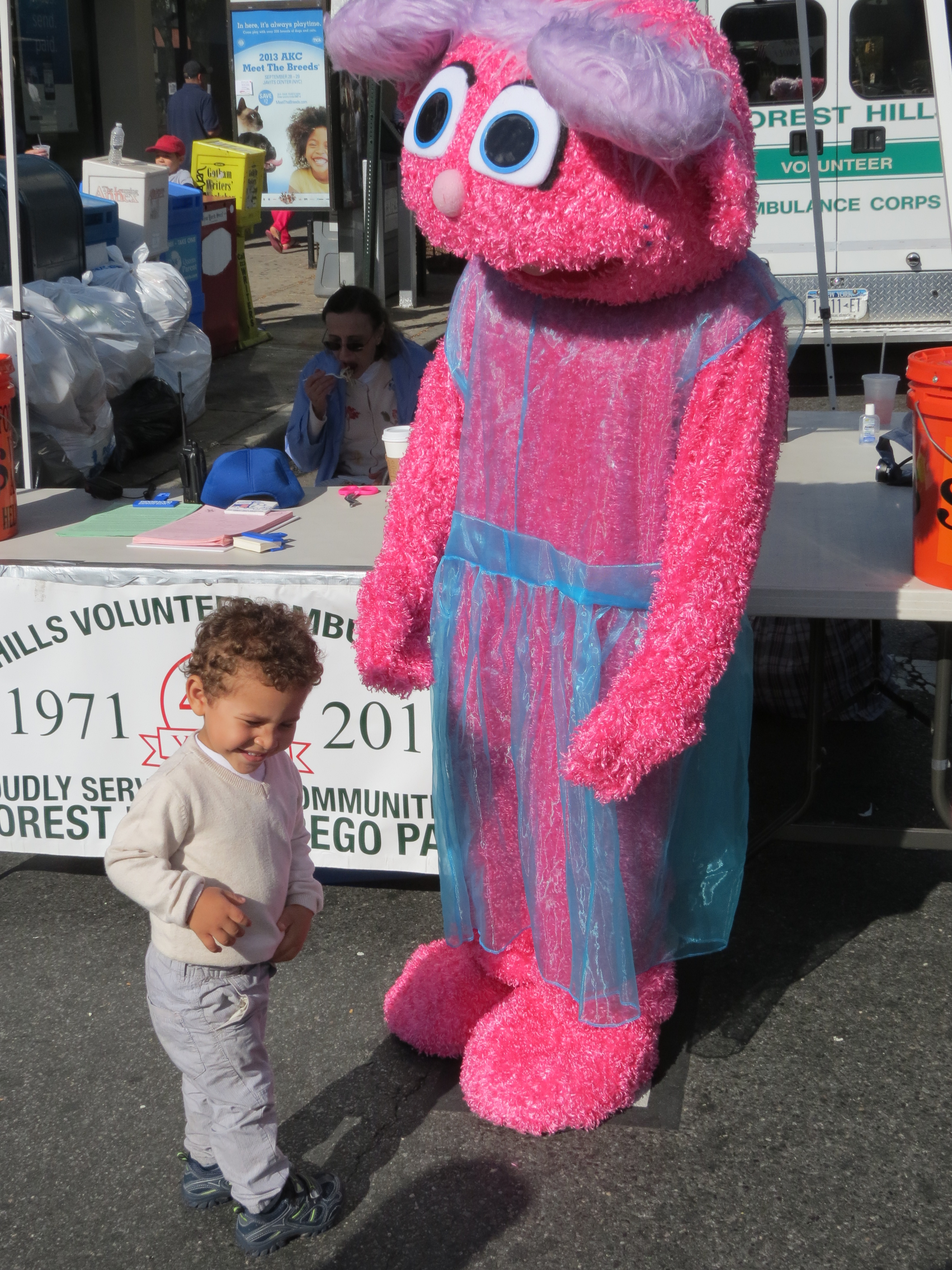 Mason Ramirez, 3, of Fresh Meadows was thrilled to spend time with "Abby," a furry friend who entertained fair goers at the Forest Hills Volunteer Ambulance Corps' stand. The costumed character is part of the nonprofit Party Pals NYC, which provides entertainment for a variety of events to raise money for a wide range of causes, including the Kidney Foundation and the Brain Cancer Foundation.