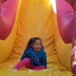 Children lined up by the dozen to fly down a number of inflatable slides at the festival.