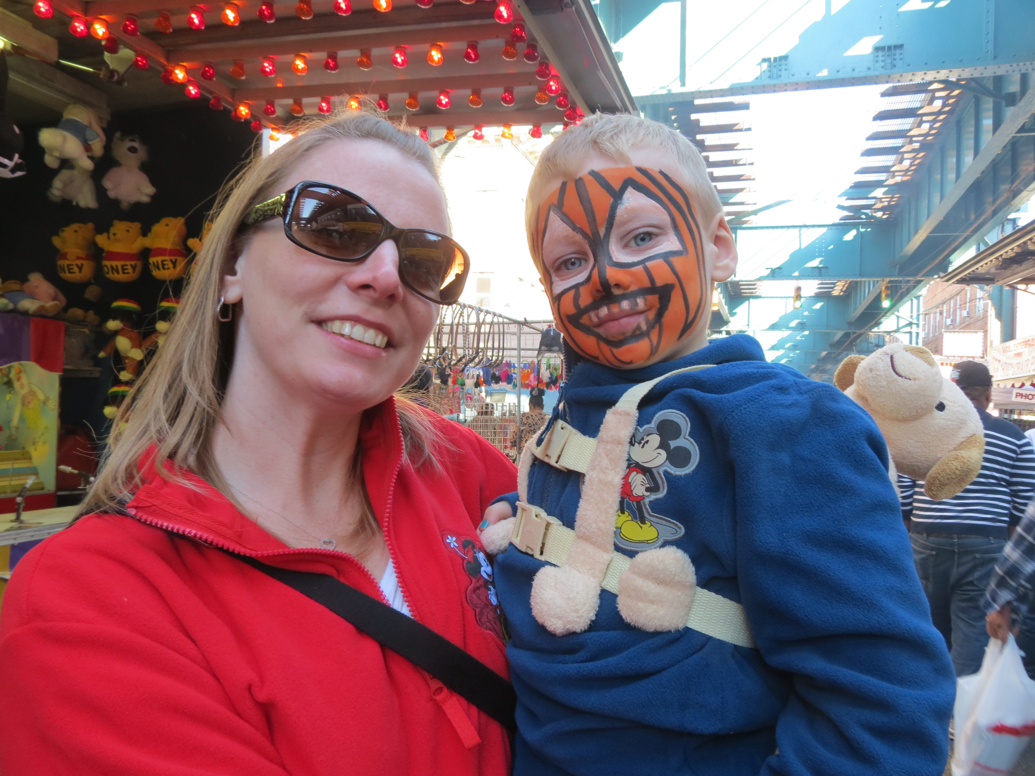 Christine, left, and Owen, 4, Branigan, of Woodhaven, show off Owen’s jack o’lantern face painting.