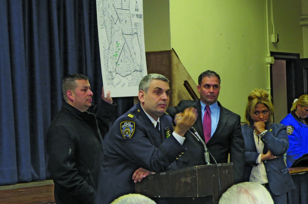 Captain Thomas Conforti addressed more than 400 residents who filled a church basement back in April in response to the emergence of a burglary pattern in Forest Hills. Now, after five months, and a crucial arrest, residents can breathe a little easier. File Photo 