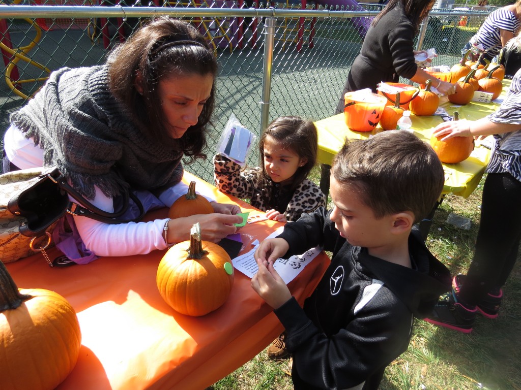 Christopher 5, and sister Sophia 4, were two of many pumpkin decorators determined to create the best pumpkin face.
