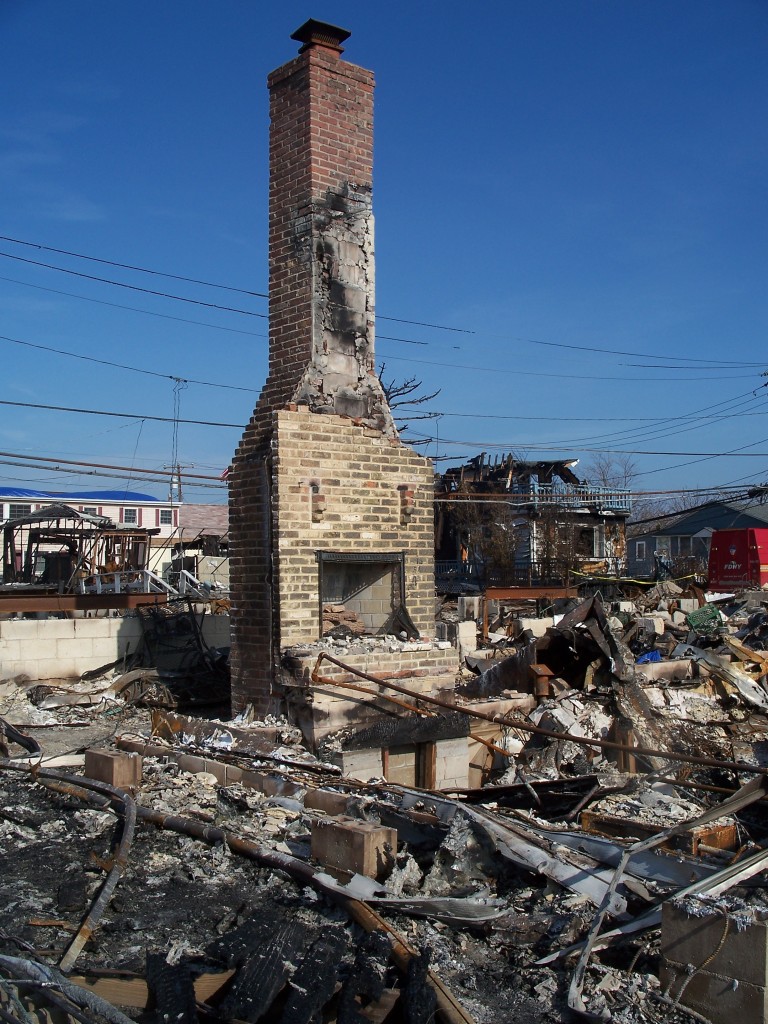 The only thing standing and barely destroyed was this chimney, from a home in Breezy Point, where over one hundred homes burned to the ground during the hurricane. Photo Courtesy Caroline Roswell 