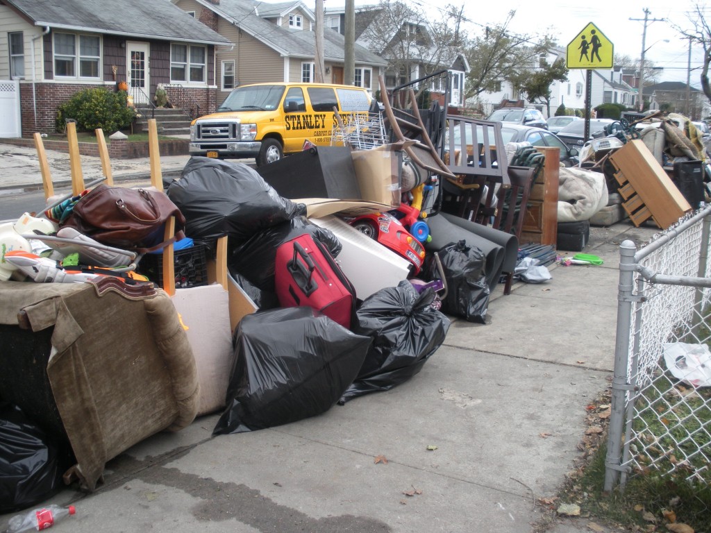 Furniture, luggage, garbage–lifetimes of possessions–stood before home after home, a grim reminder, blocks long, of everything lost. Photo Couresy Donna Faiella
