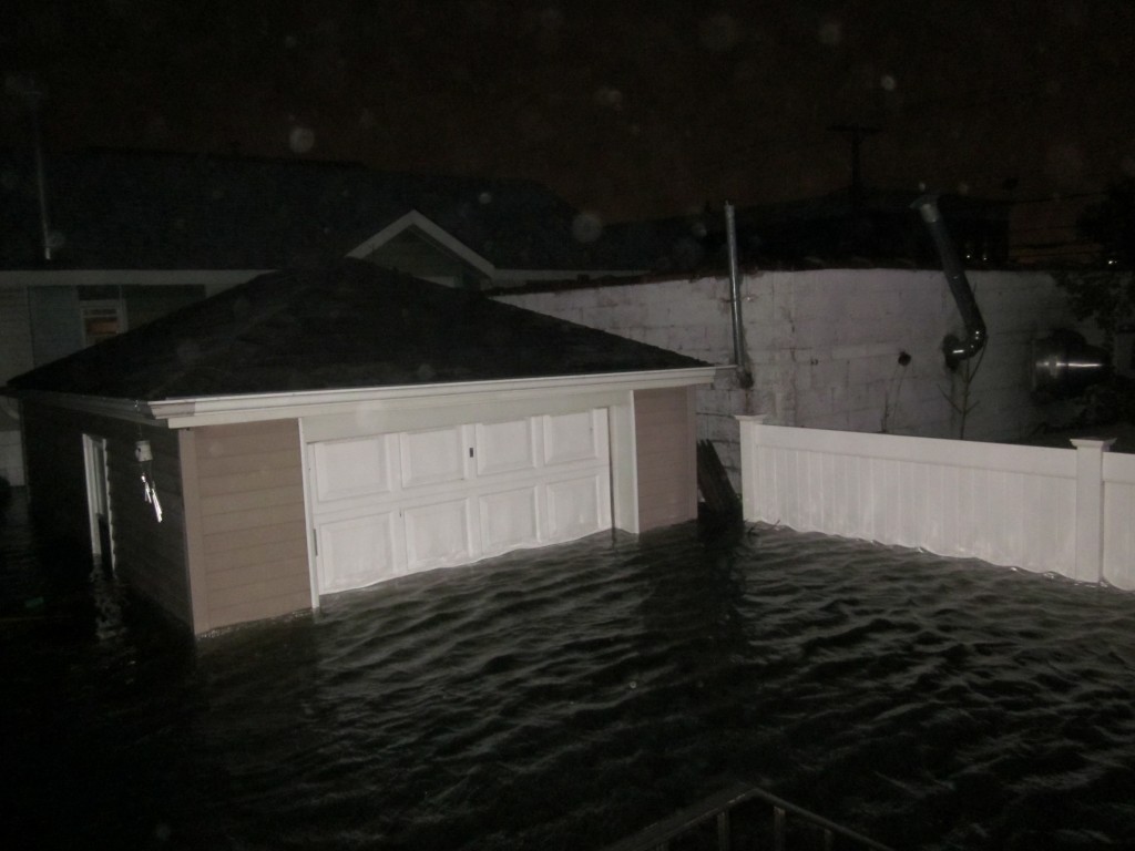 Hundreds upon hundreds of vehicles left in garages throughout Howard Beach were destroyed when flood waters moved through barriers, sandbags and other means installed to try and protect them. Photo Courtesy Laura Riley