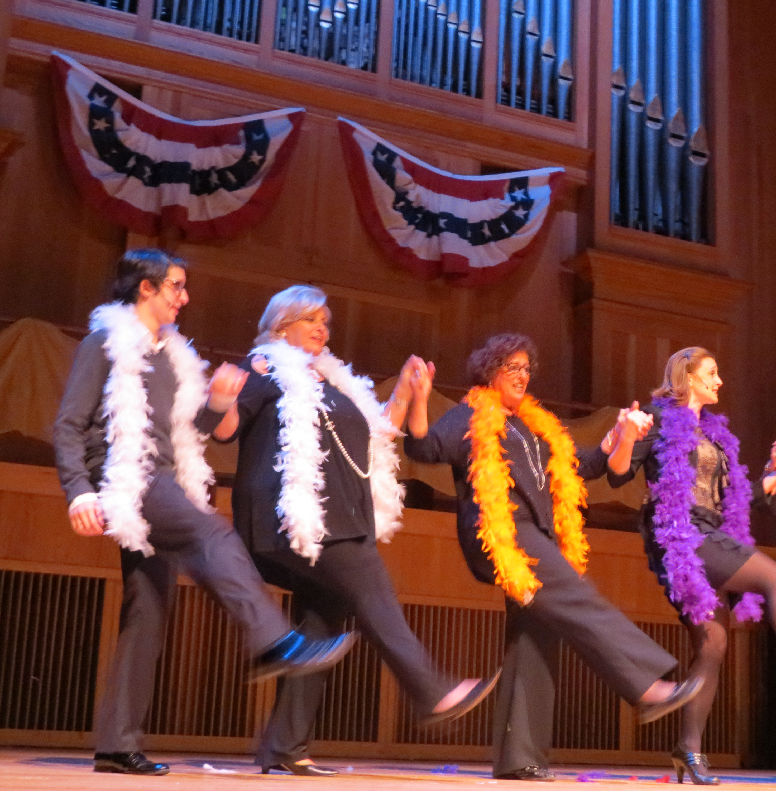 Assemblywoman Audrey Pheffer, third from left, and other performers got many a chuckle while flinging their boas around while dancing.