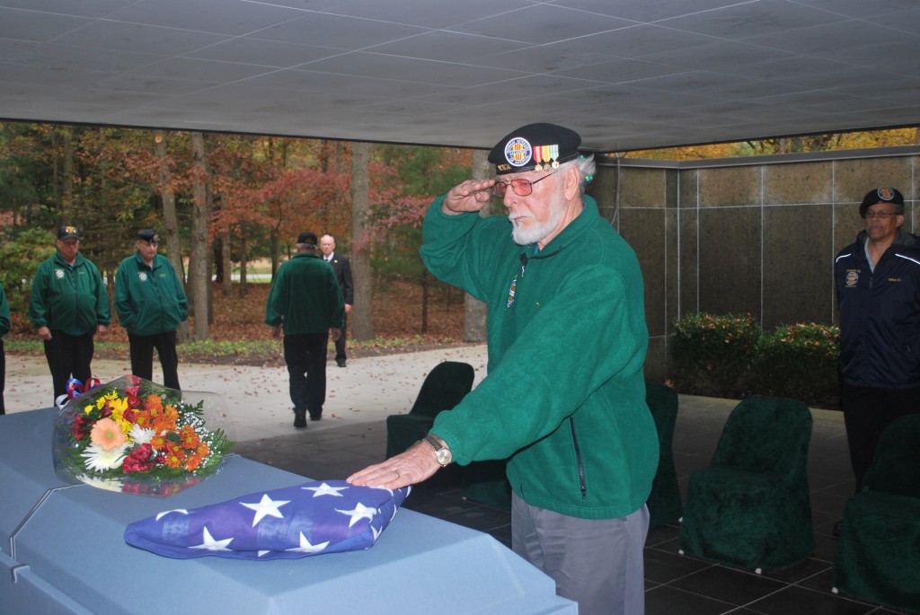 Tom Van Etten, a member of the Vietnam Veterans of America Chapter 32, salutes the coffin of Randolph Michael Royal at Calverton National Cemetery last week. Photos Courtesy Tom Corbin