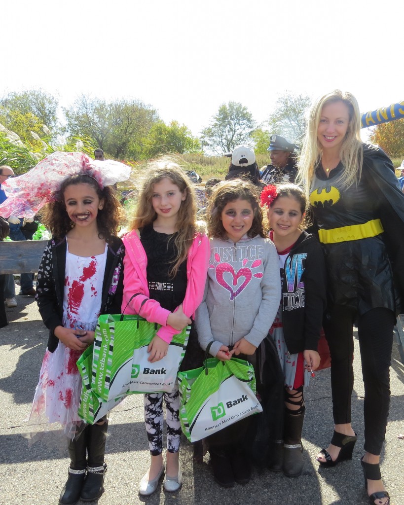 Looking all ghoulish and groovy, girlfriends Gabby, 10 Isabella 9, Allie 9, and Nikki 9 were out for a day of chaperoned fun with Batgirl—who is not 9 or 10.  