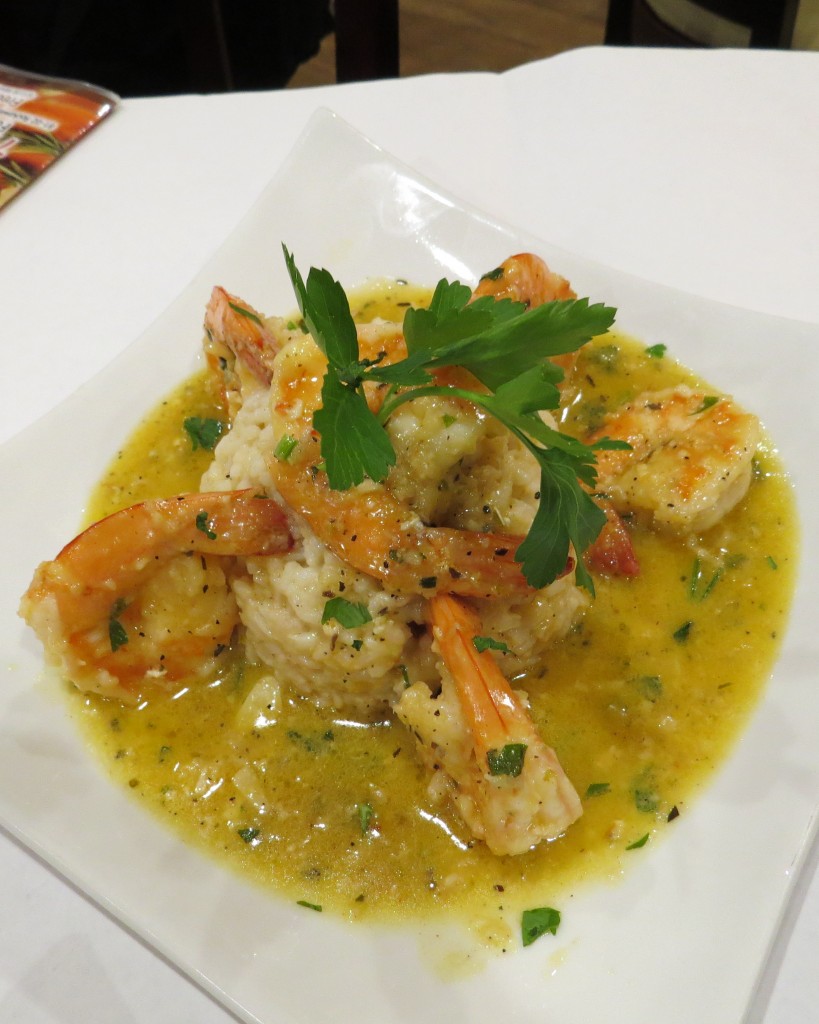 A presentation that is truly dressed for dinner, Jumbo shrimp rests on a bed of creamy risotto with a hint of garlic and the overtones of fresh parsley.