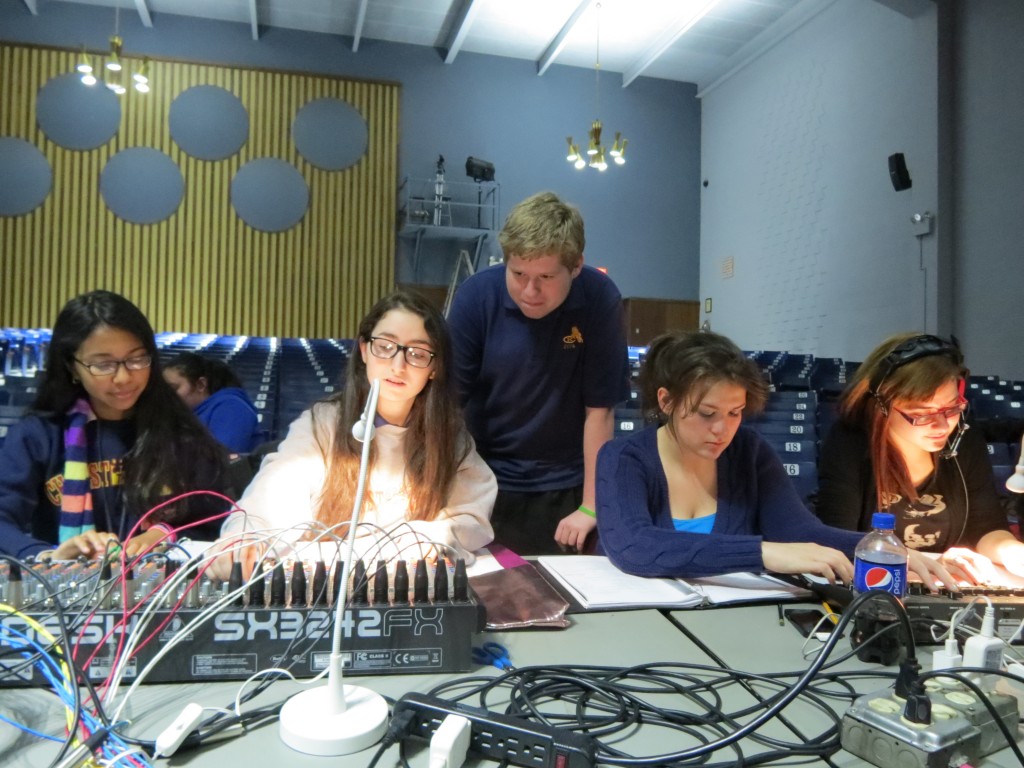 Students work on the show's lighting and sound.