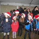 Santa spends time handing out goodies and cheer to youngsters thrilled to catch a glimpse of the North Pole resident.