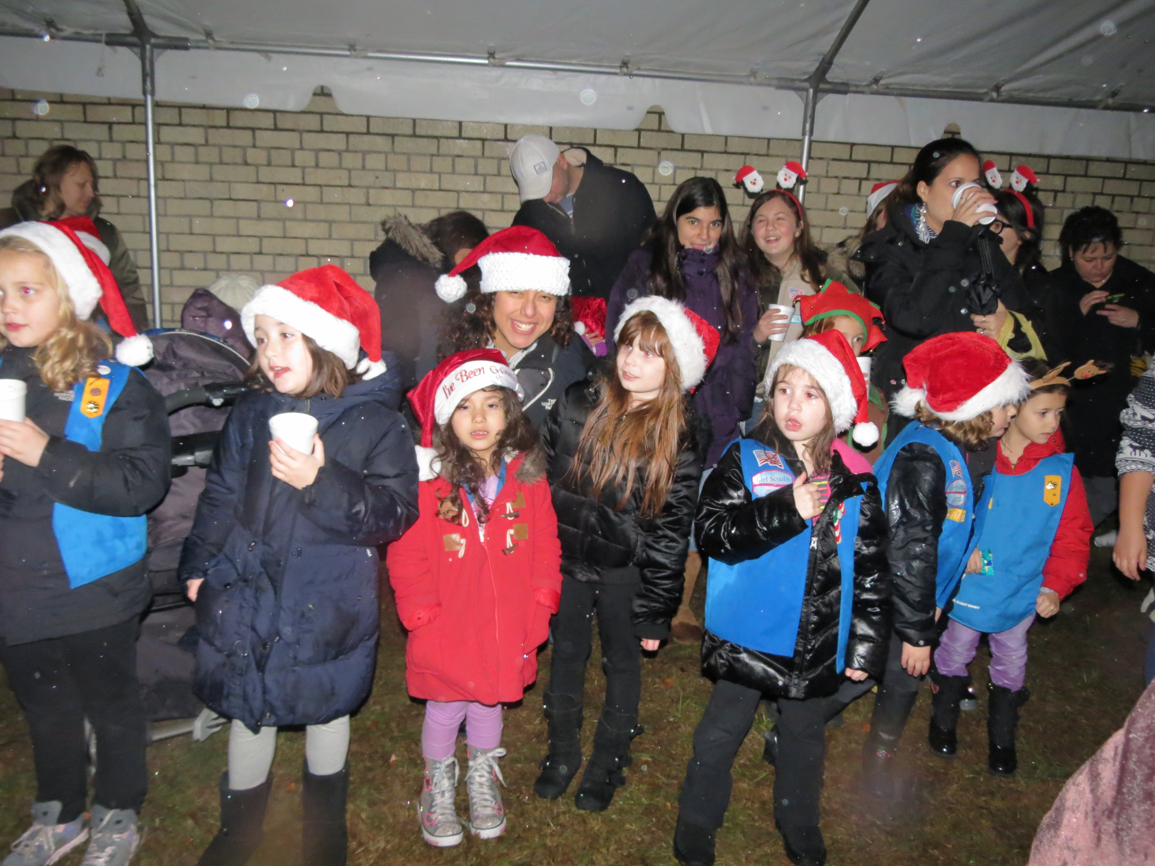 Santa spends time handing out goodies and cheer to youngsters thrilled to catch a glimpse of the North Pole resident.