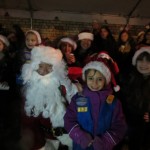 The crowd sings many a Christmas carol during Friday's festivities.