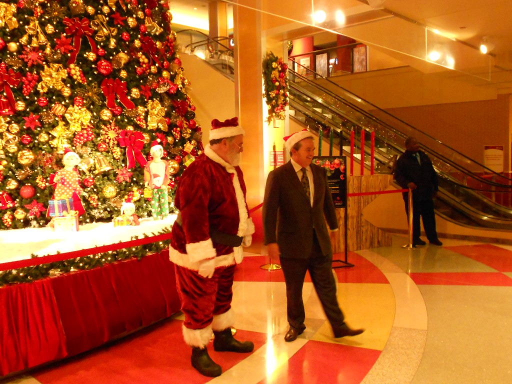 Santa Claus joined Resorts World Casino New York City President Edward Farrell to light the tree that stands a towering 40 feet. Michael Florio/The Forum Newsgroup 