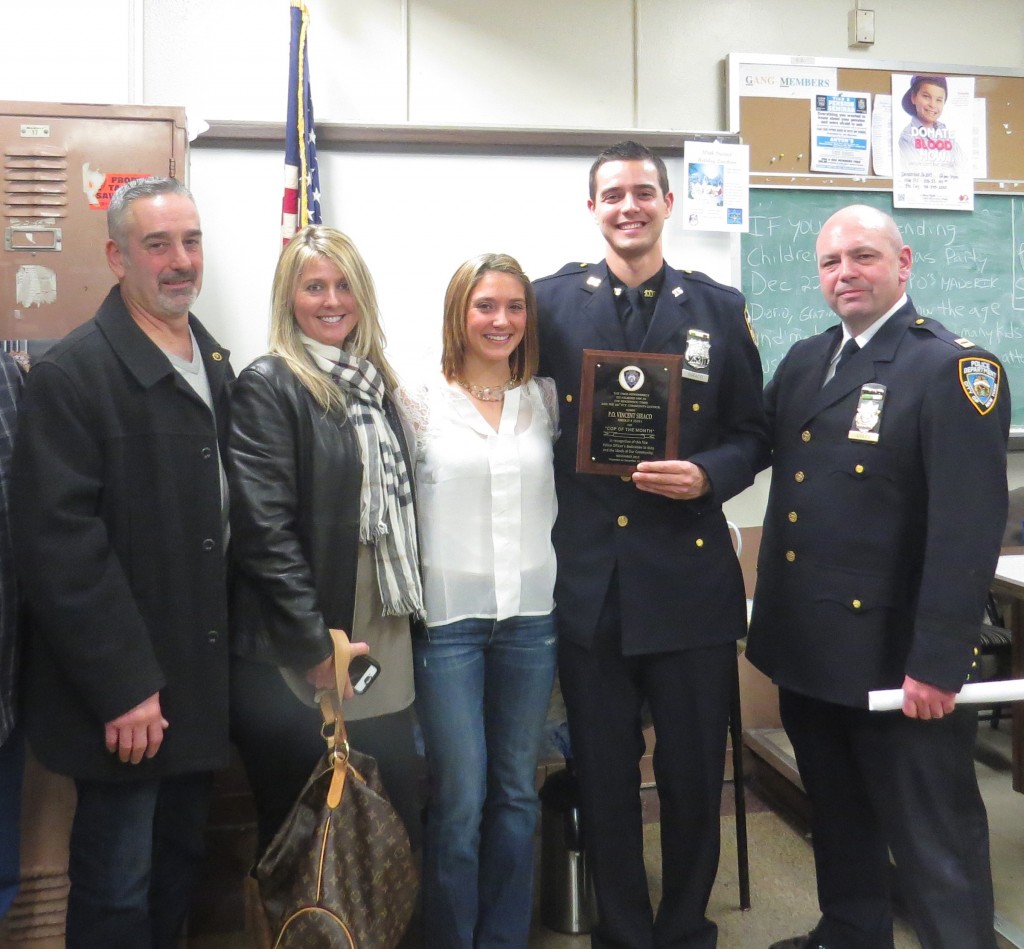 Officer Vincent Siraco’s parents, Mike and Janet, along with girlfriend, Stephanie, were on hand for the presentation of his award from the new executive officer at the 106, John Ganley.  Patricia Adams/The Forum Newsgroup 