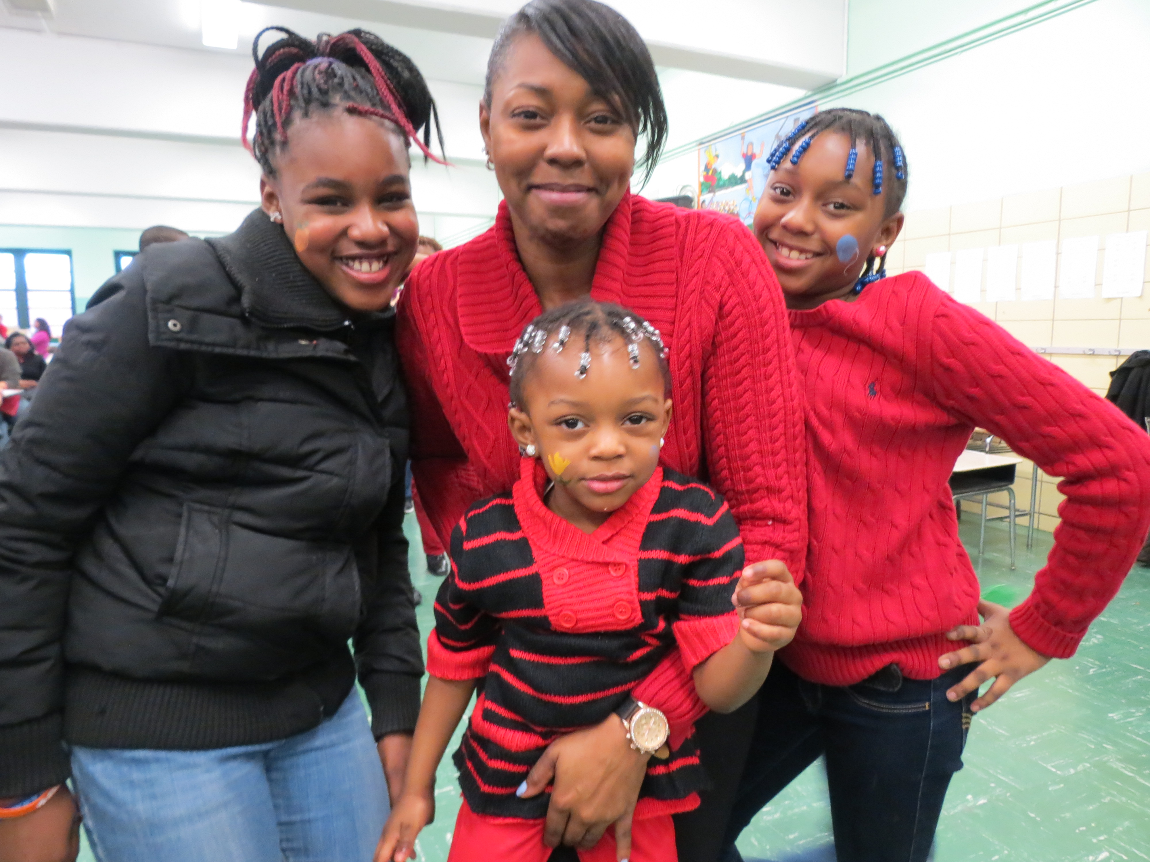 Katana, 11, left; Geneva; Briyanna, 10; and Jada, 3, Dunning said they were thrilled to attend the party for NYFAC, for which Geneva works as a receptionist.