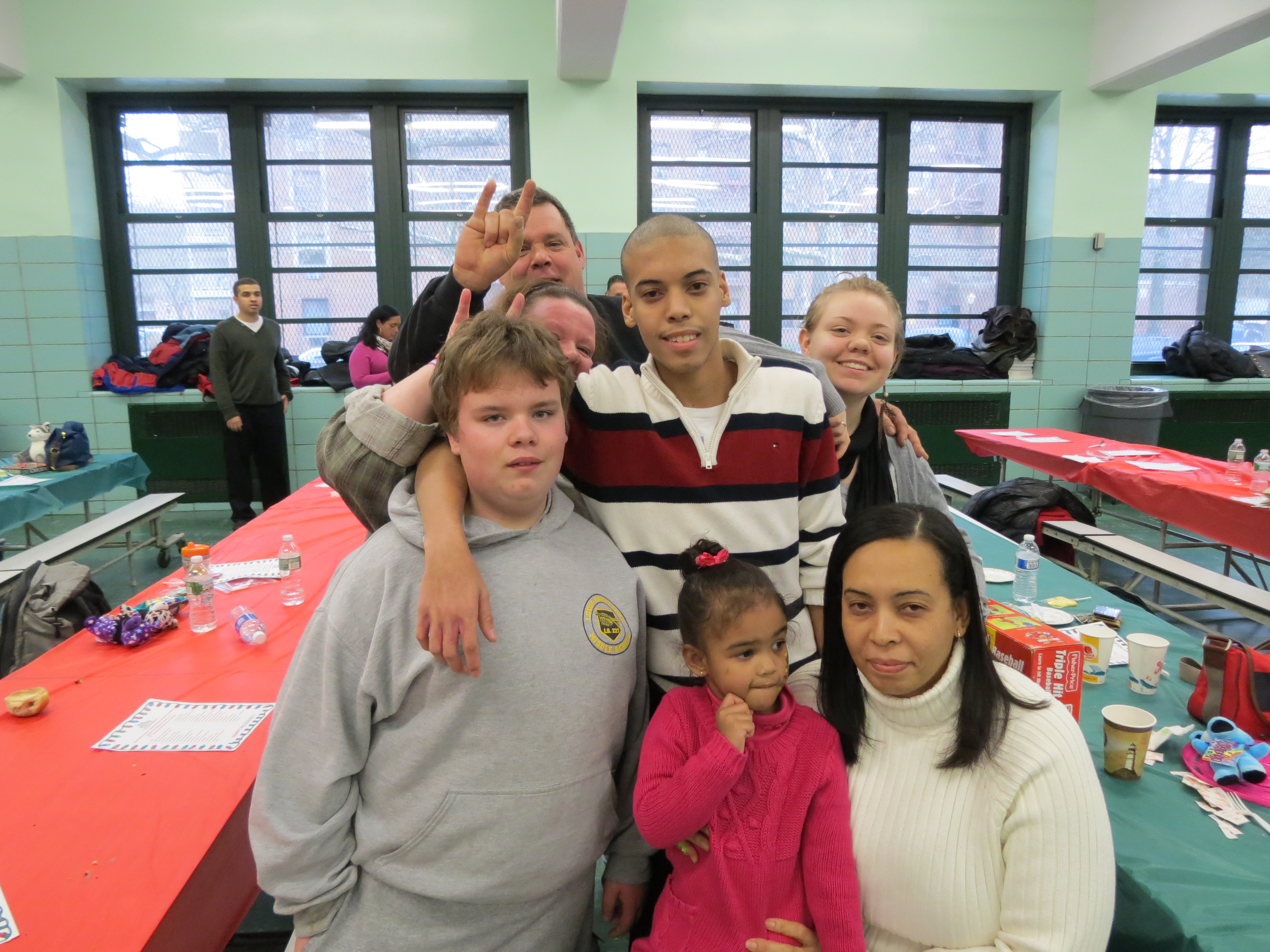 Michael McKeon, front left, 14, and Nicholi Constantine, 16, spend time with their families at the holiday party.