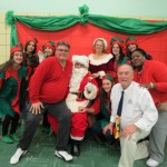 NYFAC President Andrew Baumann, front left, NYFAC Program Director Leo Compton, front right, and other revelers ring in the holiday season with Santa.