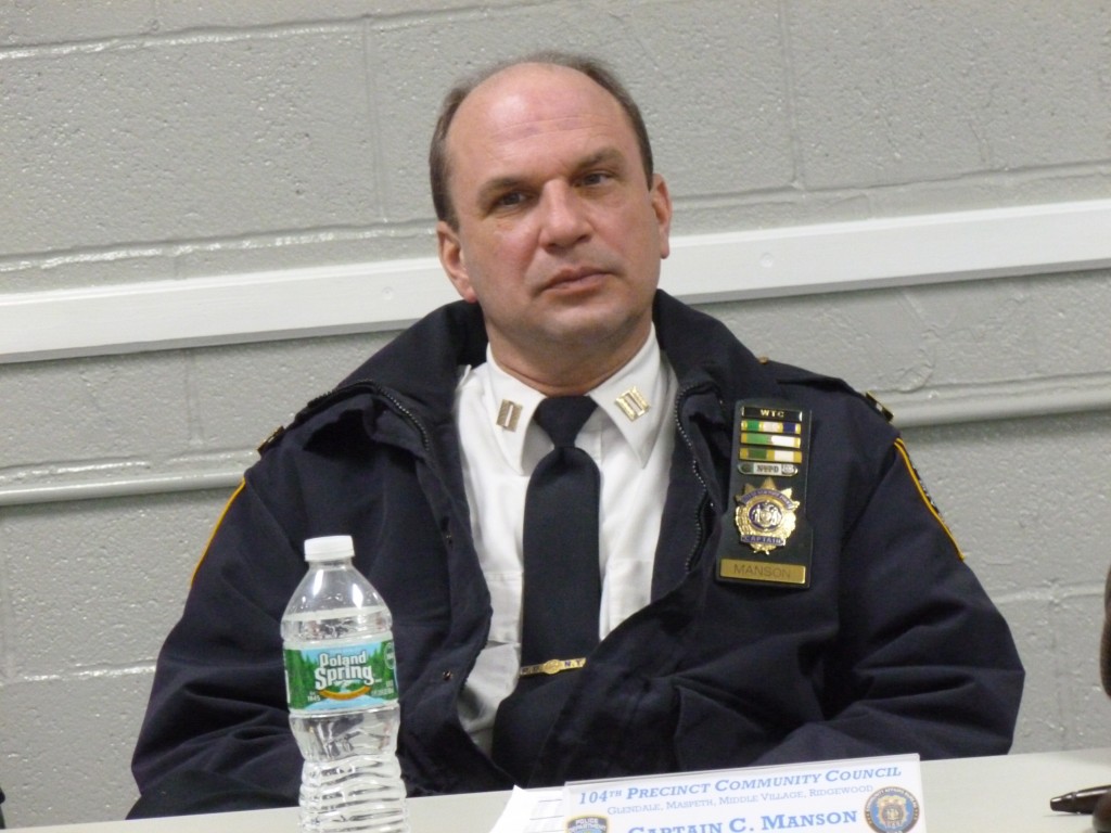 While two men were arrested this week and charged with breaking into a number of places throughout Queens, including in Ridgewood and Glendale, Capt. Christopher Manson, pictured, and officers from the 104th Precinct are urging residents to continue to be aware of their surroundings. Photo by Phil Corso