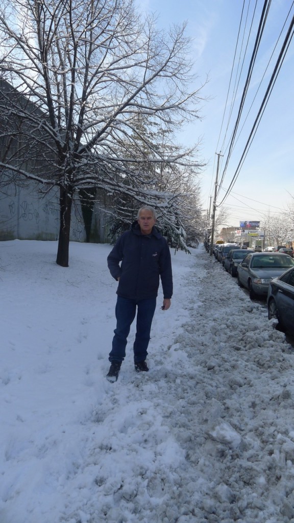 Juniper Park Civic Association President Robert Holden stands on 57th Avenue, looking west from 80th Street, where he said the city consistently fails to shovel, leaving the area dangerously icy for pedestrians. Photo courtesy Robert Holden