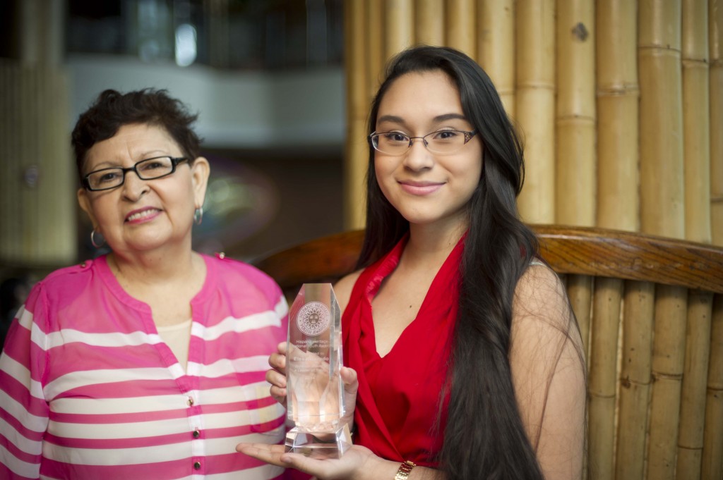 Elsa Alvarado, right, of Glendale, accepts a prestigious National Youth Award in Education from the Hispanic Heritage Foundation as her grandmother, Maria Bermudez, looks on.  Photo courtesy Hispanic Heritage Foundation/Omar Ogues 