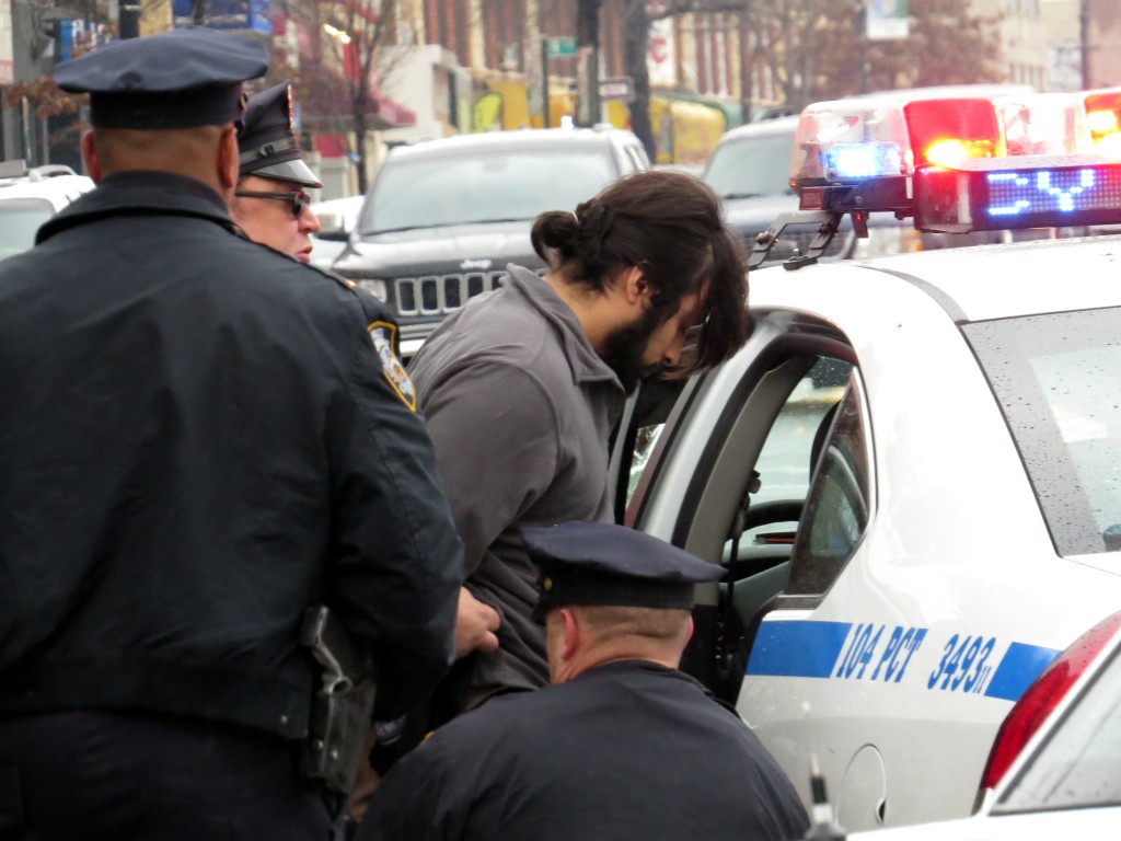  Abel Tinoco, who police said hit a 68-year-old woman after he made an illegal left-hand turn from 69th place onto Grand Avenue in Maspeth, was taken into custody by police at the scene and later charged with aggravated driving without a license. Photo by Robert Stridiron