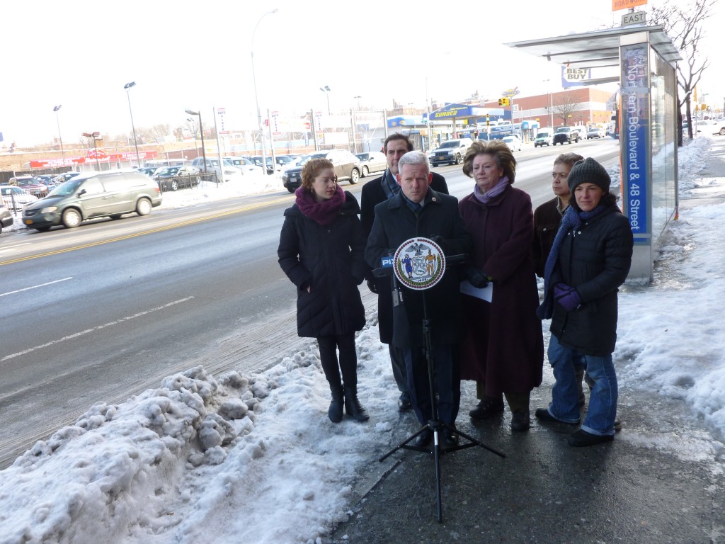 Councilman Jimmy Van Bramer, center, state Sen. Michael Gianaris, behind Van Bramer, Assemblywoman Marge Markey, third from right, and other transportation advocates, gathered at Northern Boulevard and 48th Street last Thursday to call on Mayor de Blasio to include the intersection in his traffic safety plan that aims to cut pedestrian deaths to zero over the next decade.  Photo by Phil Corso