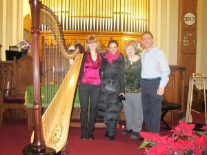 Harpist Tomina Parvanova, left, Sira Melikian, church historian Marjorie Melikian, and Michael Perlman of the Rego-Forest Preservation Council, at Sunday's concert that helped raise funds for the restoration of the historic First Presbyterian Church of Newtown in Elmhurst.